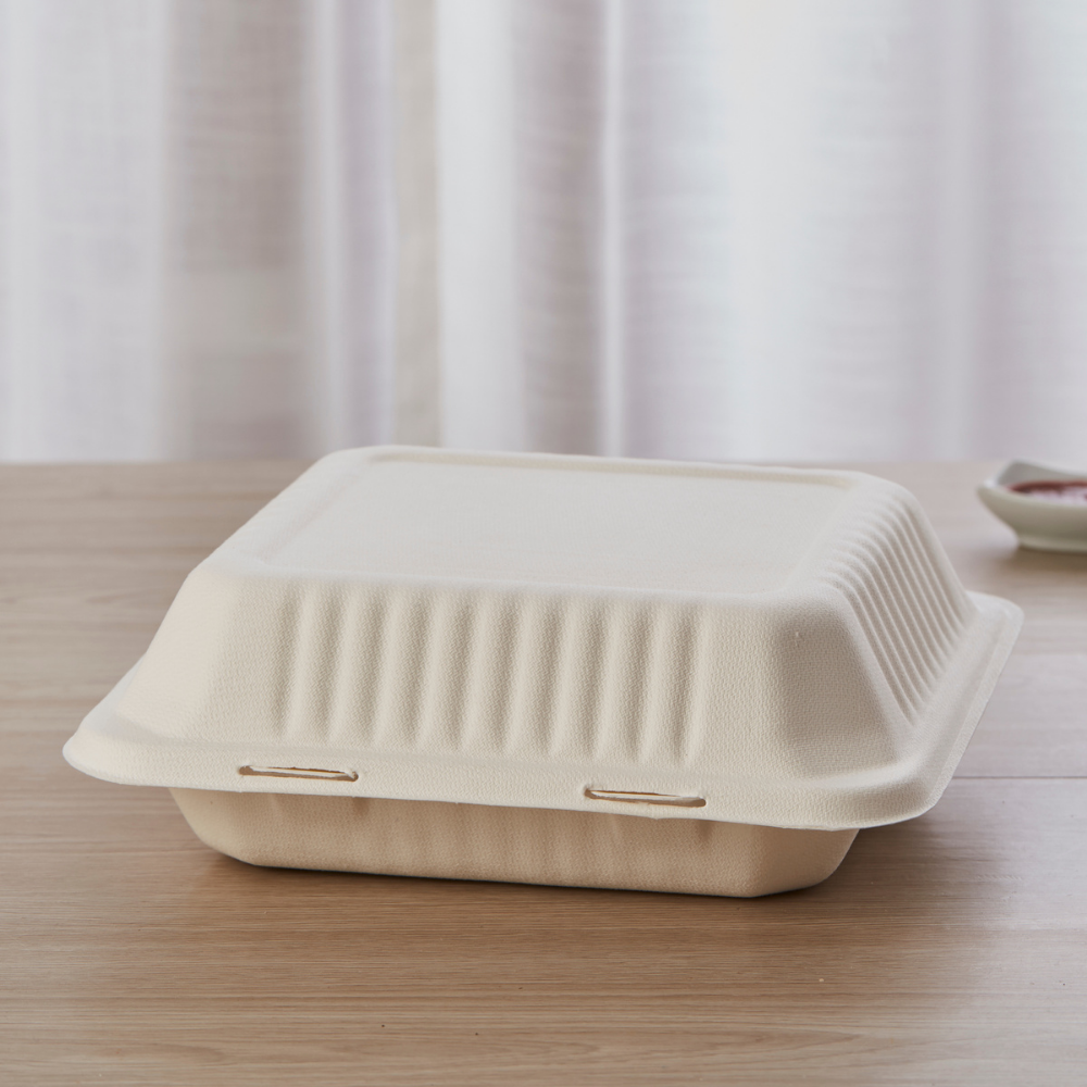 HD-B037 | Sugarcane Clamshell Food Container | 9x9x3" - on the table - HD BIoPak