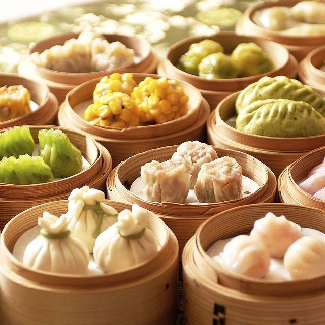 lots of dim sum sitting on a Non-Stick Round Steamer Paper and steamer