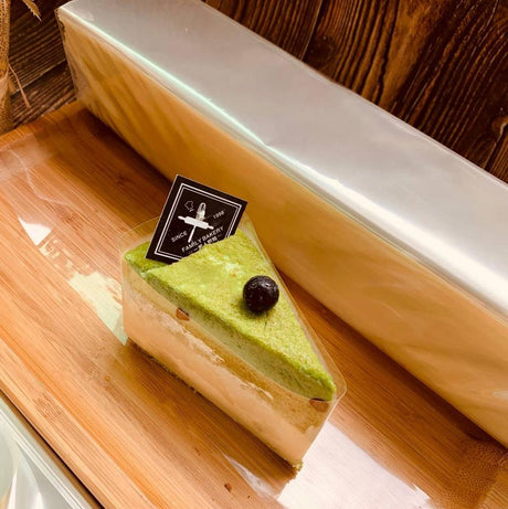 Plastic Clear Cake Wrap Film wrapping a dessert  for bakery use on a cutting board