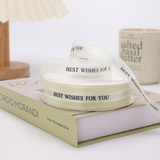 1" Best Wishes for You Creamy White Fabric Ribbon | 50 Yards - on book