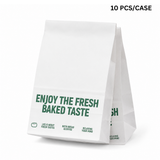White paper bag with green text on a white background